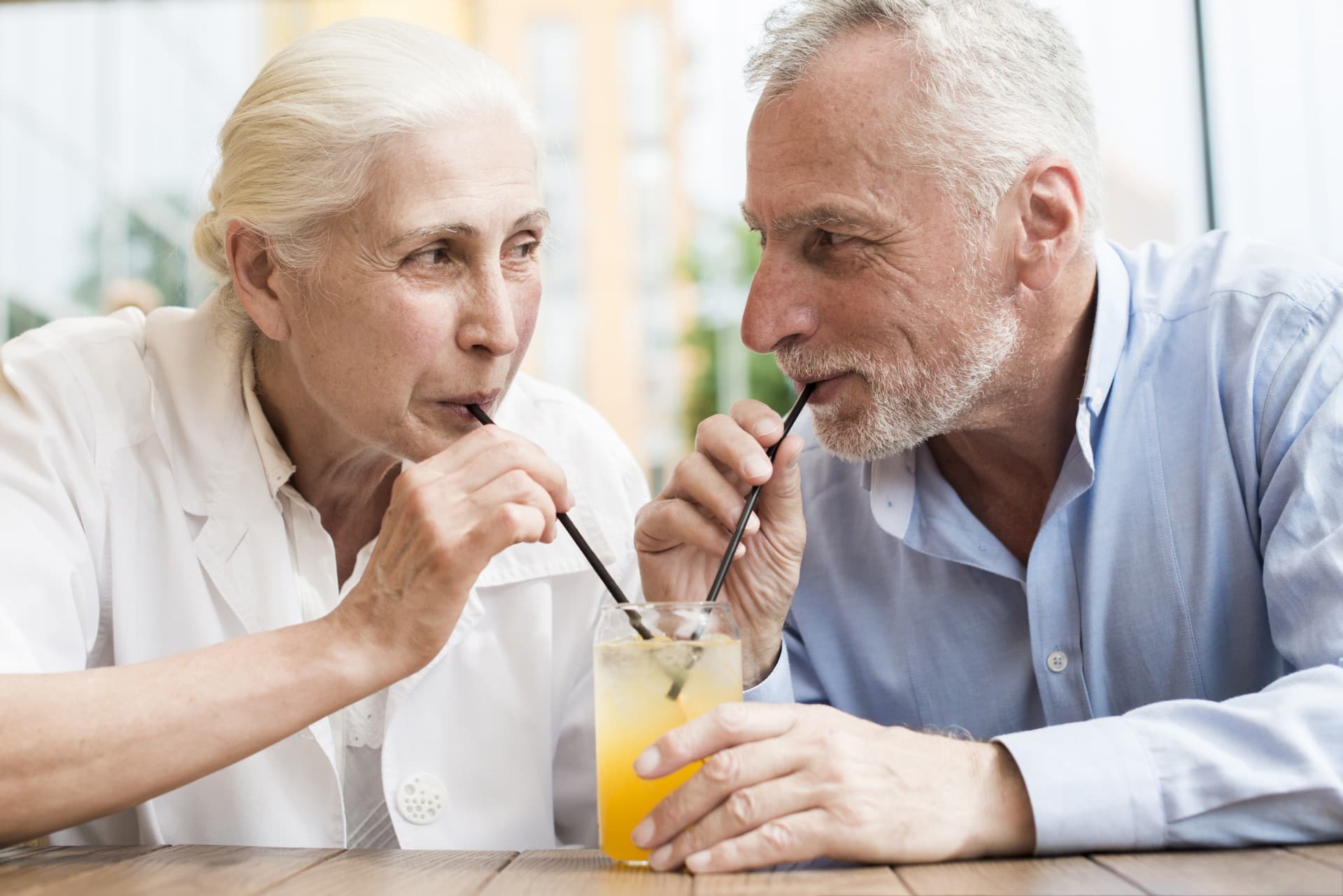 medium shot old couple looking each other